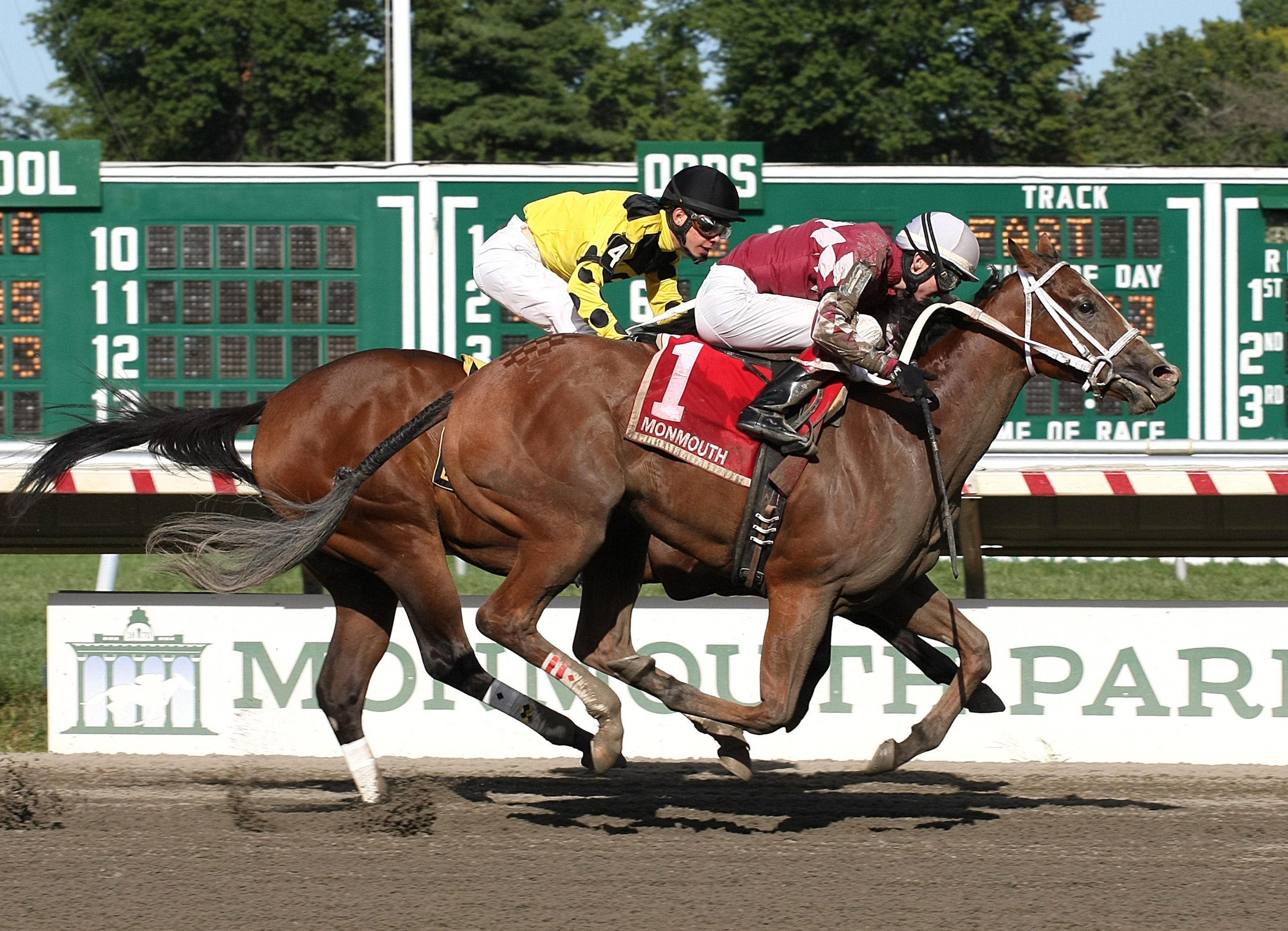 Harlan’s Holiday Filly Rallies to Remain Unbeaten at Monmouth